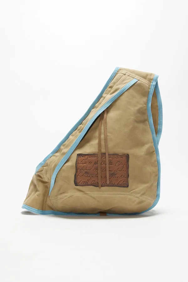 Acne Studios   SLING BACKPACK IN BEIGE/BLUE, SS24