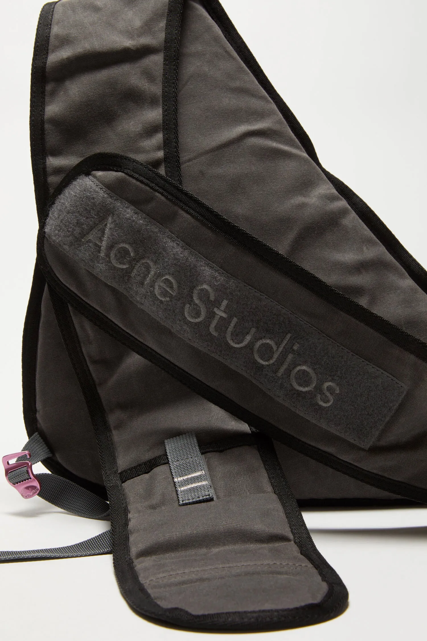 Acne Studios   SLING BACKPACK IN GREY/BLACK, SS24